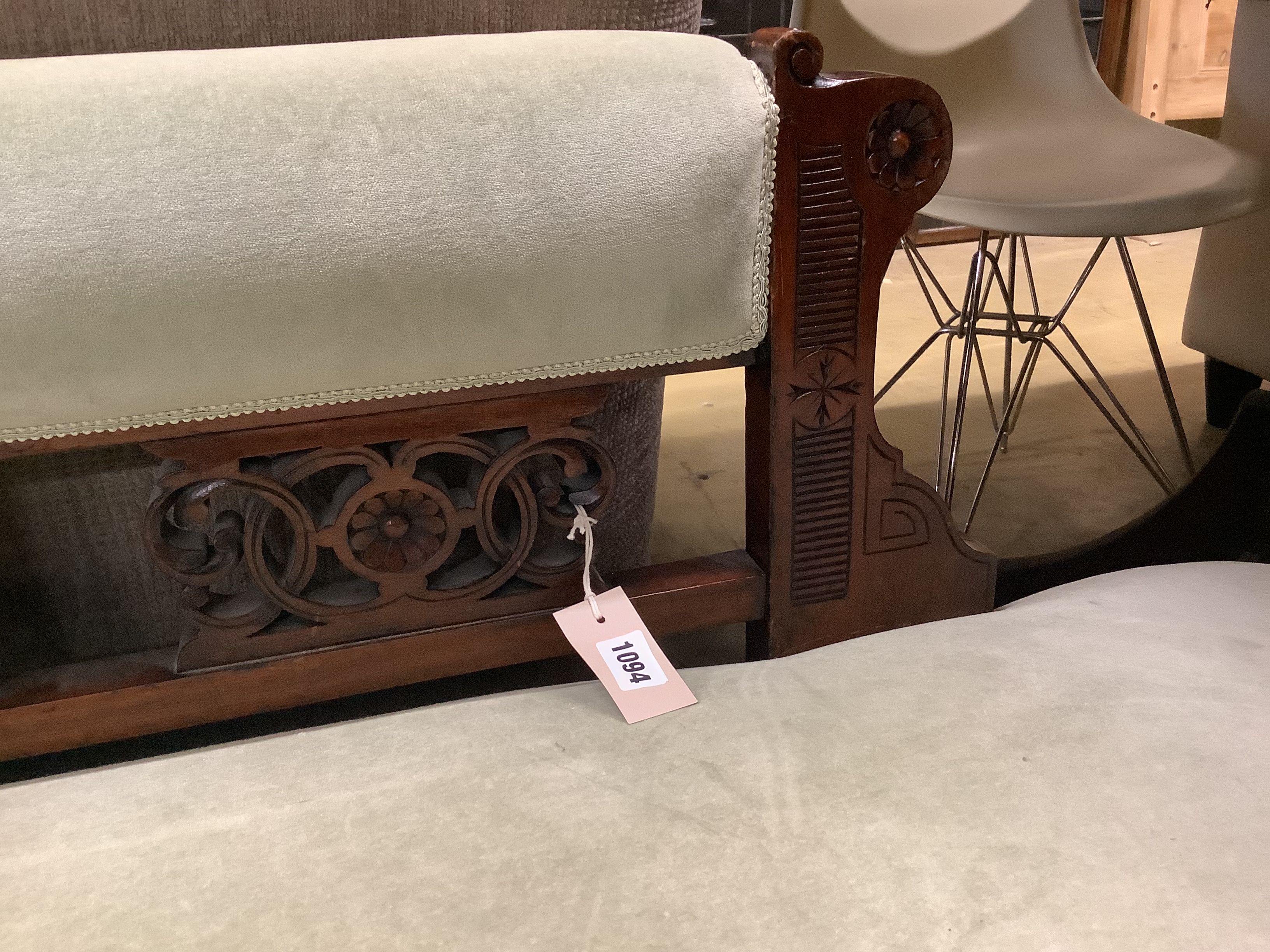 A late Victorian carved mahogany chaise longue, length 160cm, depth 60cm, height 72cm